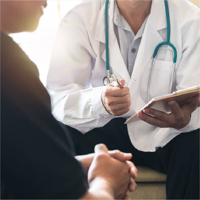 A doctor with a patient during a consultation.