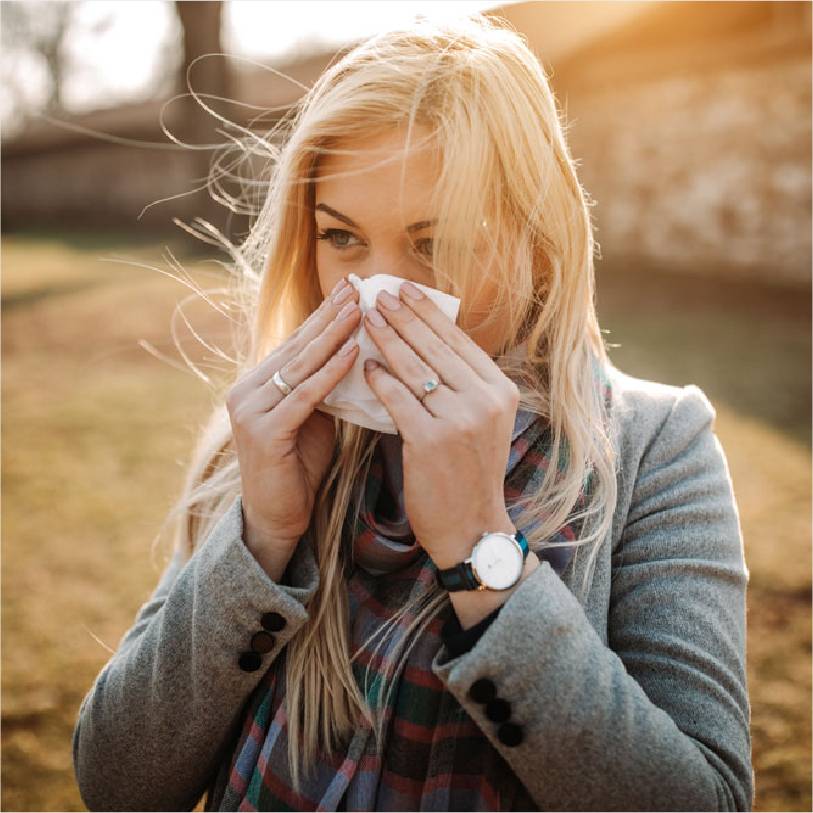 A beautiful woman with a tissue